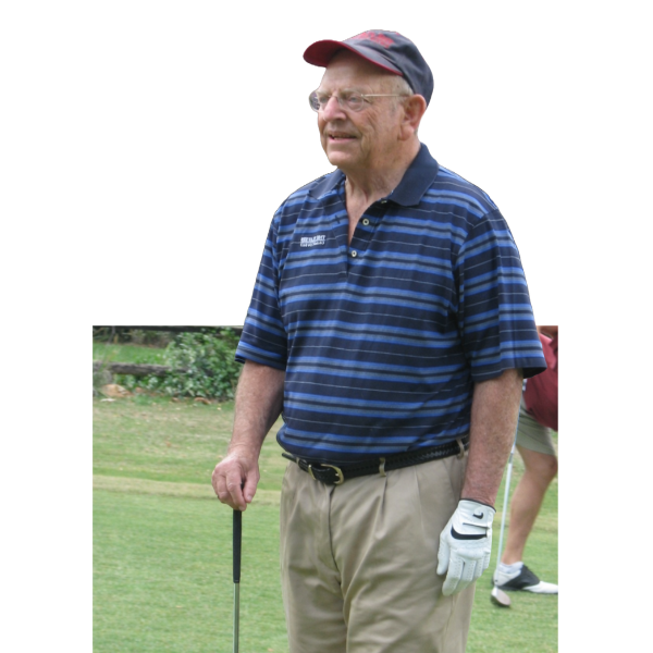 Donald Zell on golf course with golf club