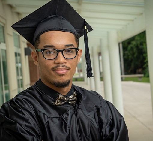 A student in graduation cap and gown