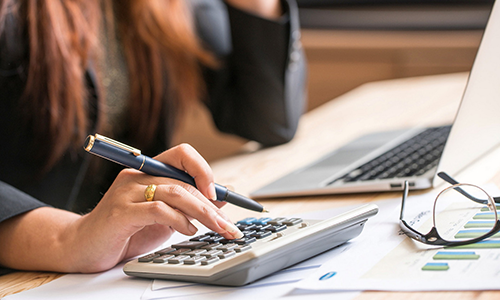 A person using a calculator