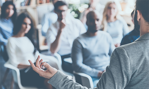 A person speaking to a group