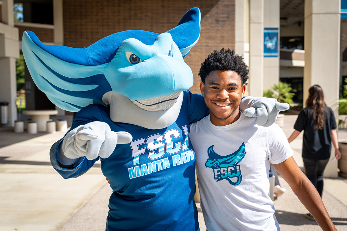 Rayzor Ready Mascot with student on campus