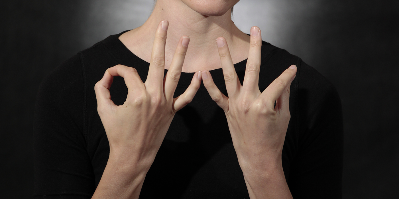 A person doing sign language