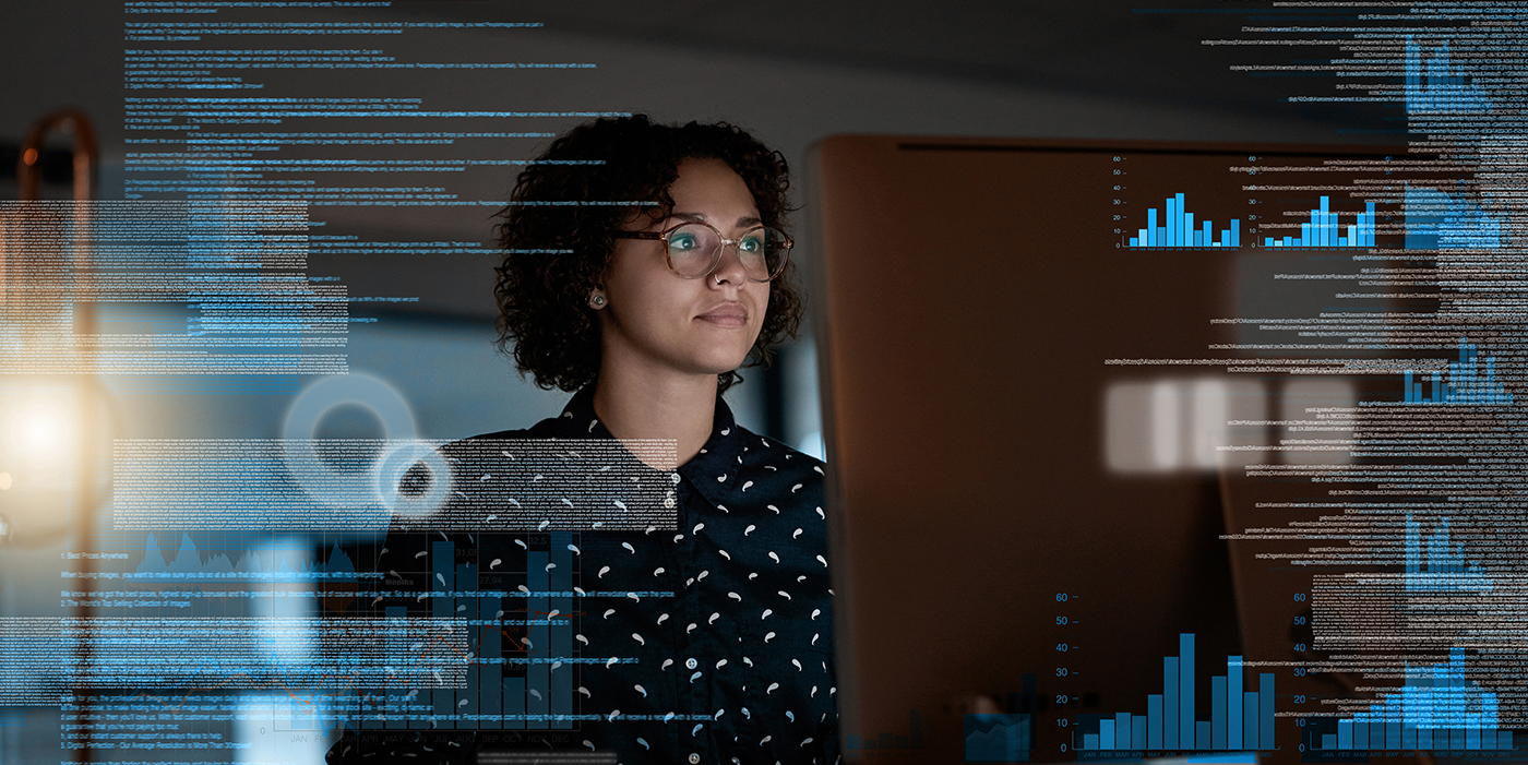 A woman using a computer with various graphical overlays