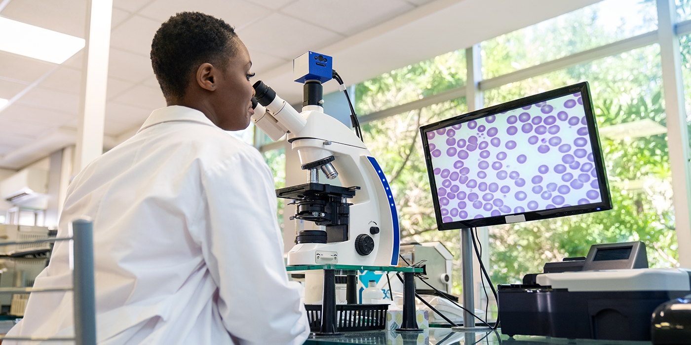 A person using a microscope