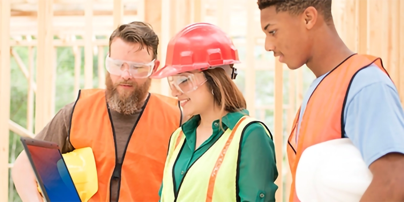 Three people in construction gear