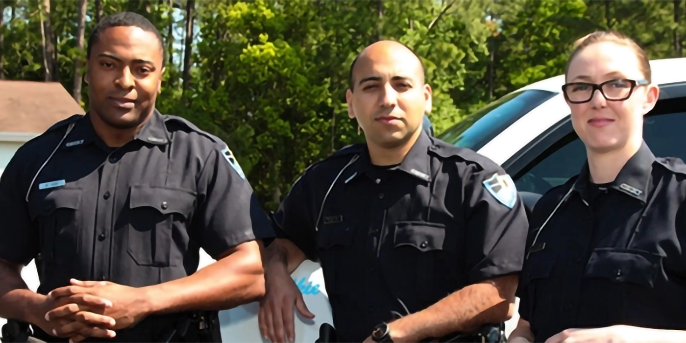 Three people in police uniforms