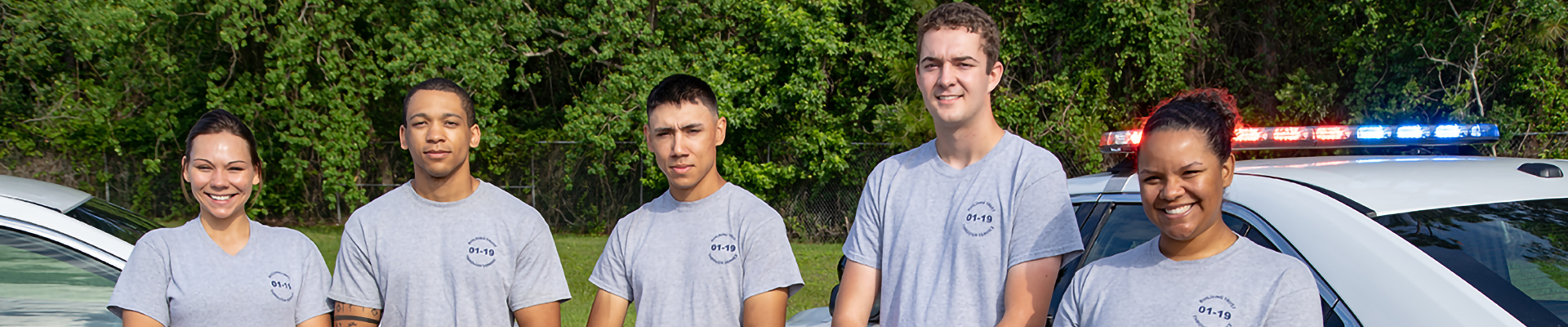 Three people in police uniforms