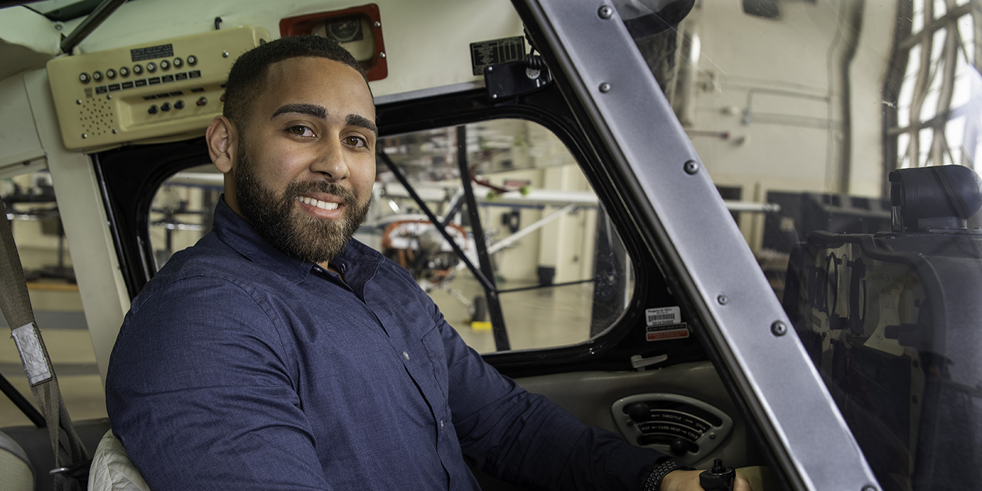 A man in a light plane cockpit
