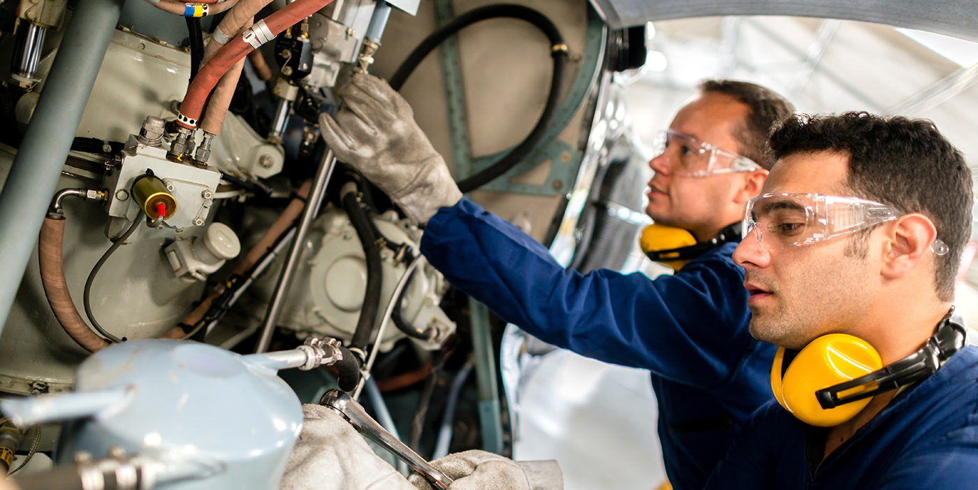 People using industrial machinery