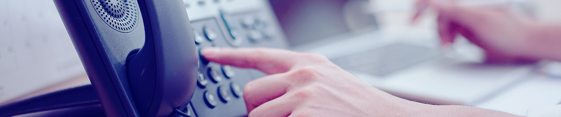 A person dialing a phone