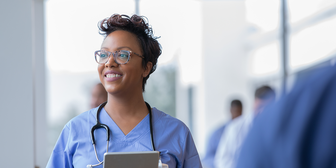 A woman in medical scrubs