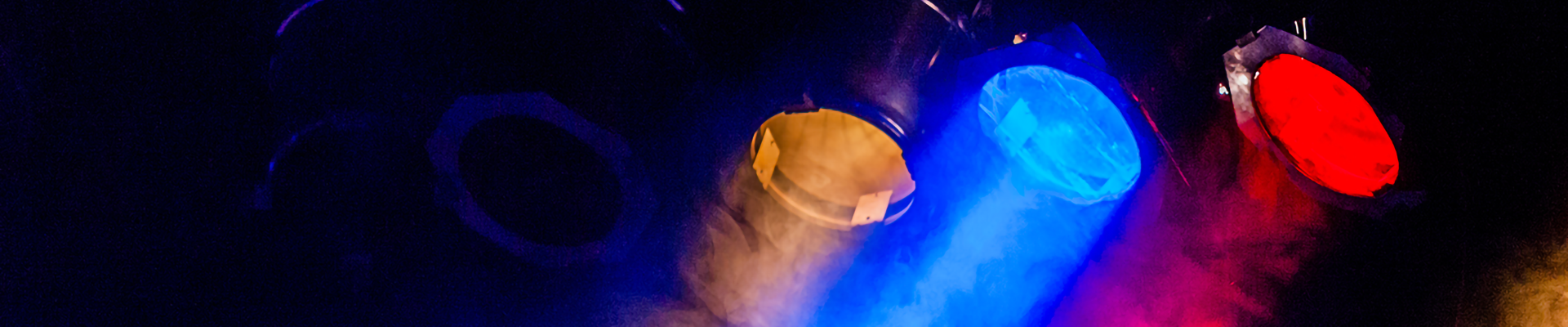 Three multi-colored stage lights