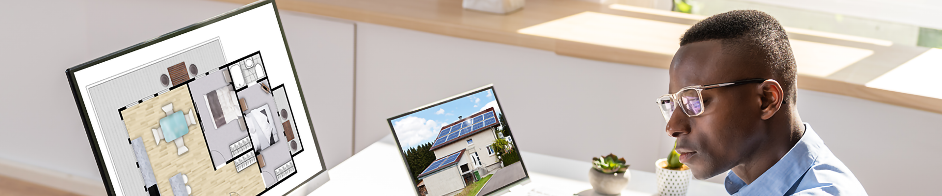 A man using architectural design software on a computer