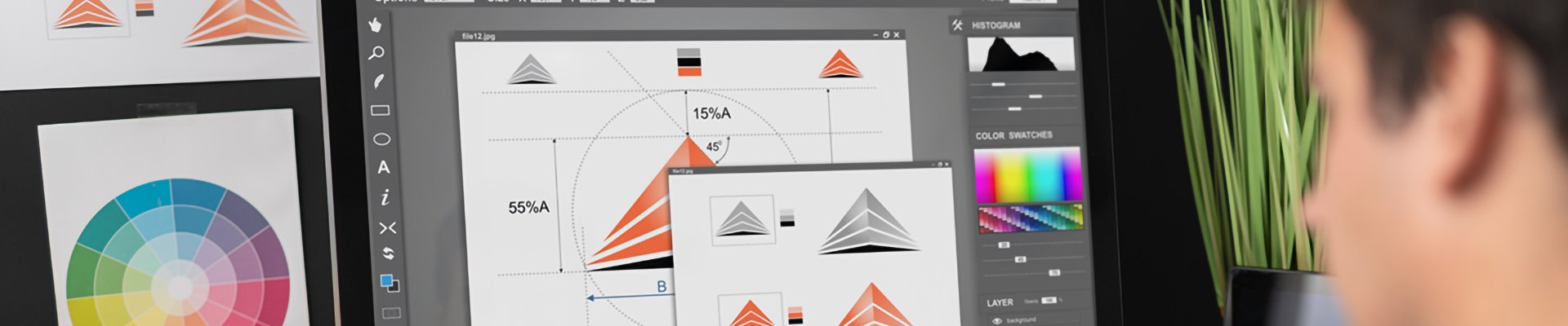 A man using graphic design software on a computer