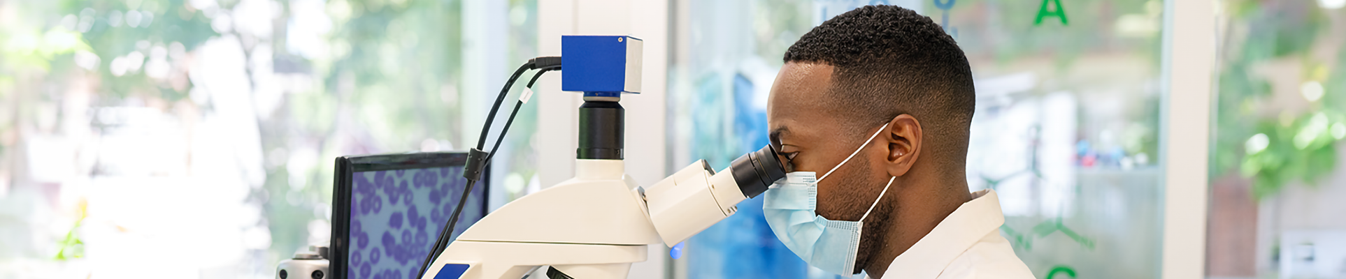 A man using a microscope