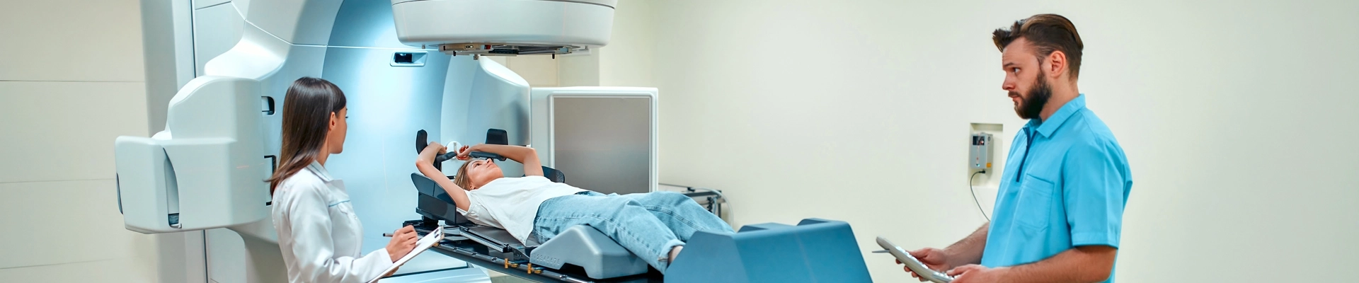 A man in medical scrubs attending to a patient