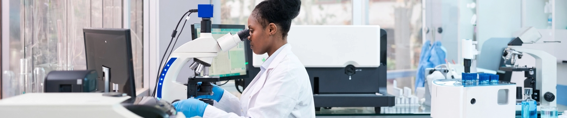 A person using a microscope