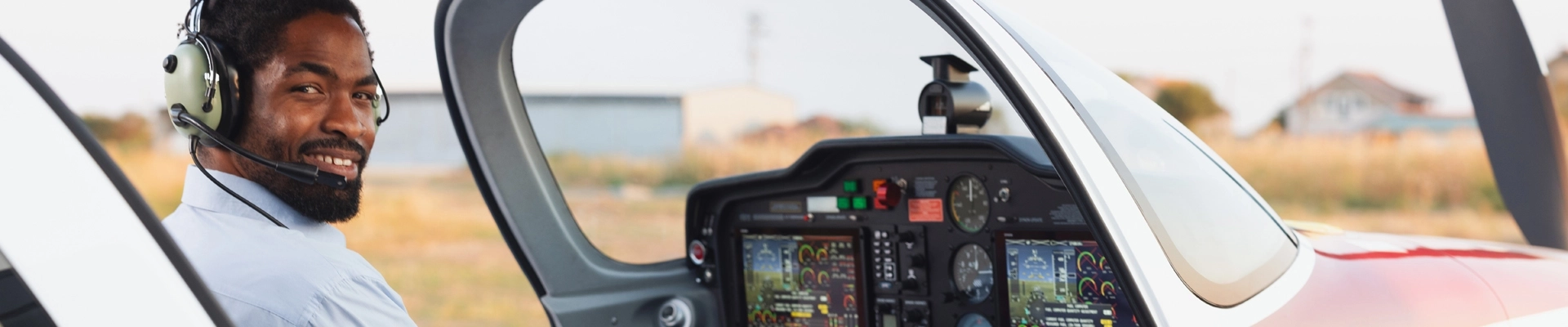 A man in a light plane cockpit