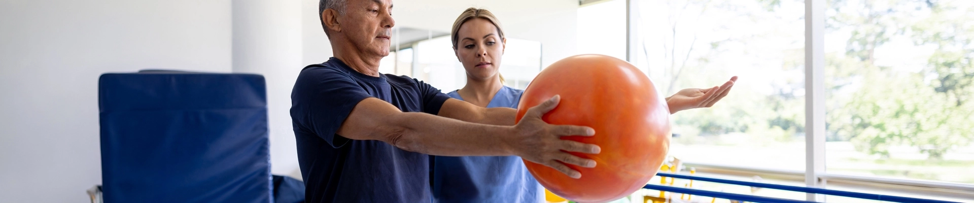 A man holding a medicine ball