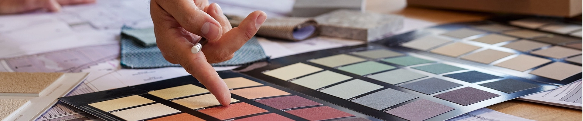 A person pointing to a color pallette