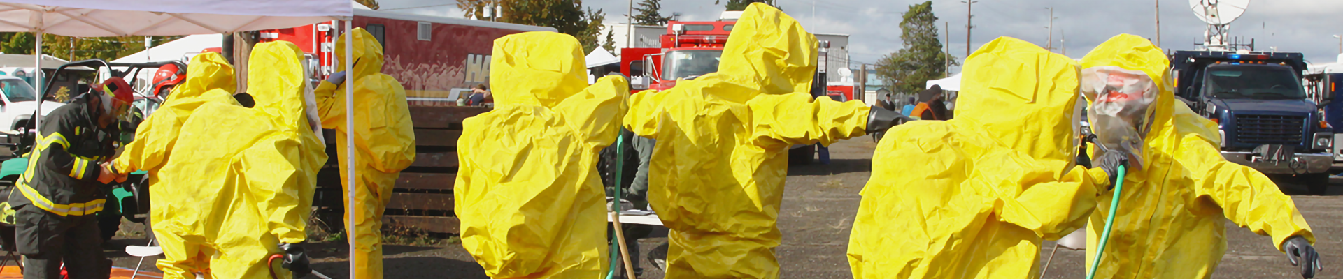 Several people in hazmat suits