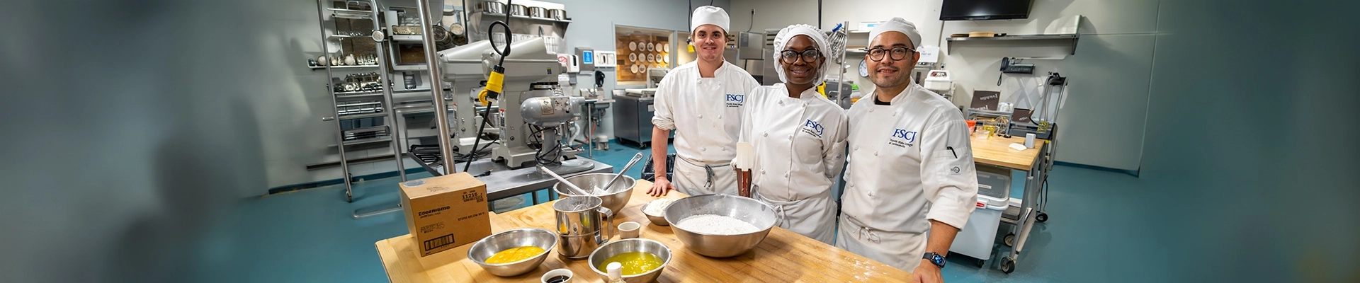 3 chefs in a kitchen