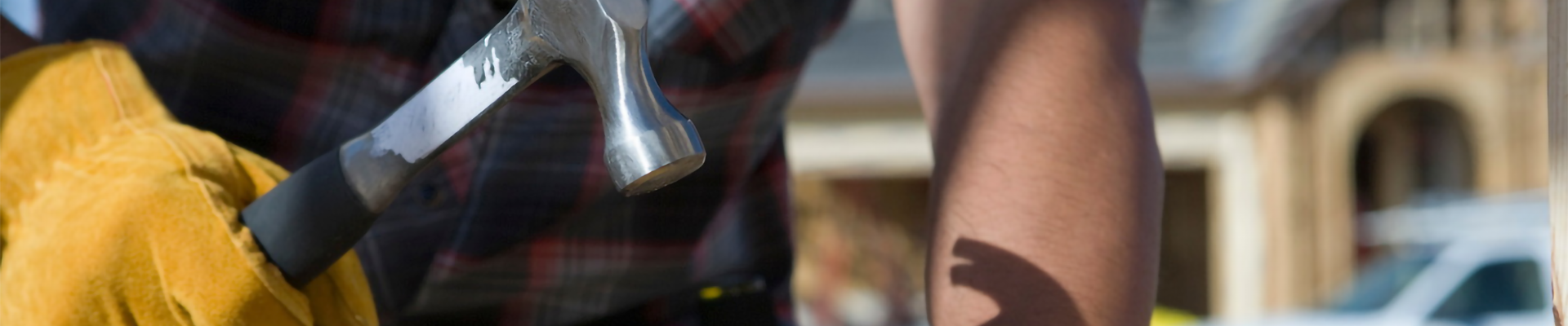 A person hammering a nail