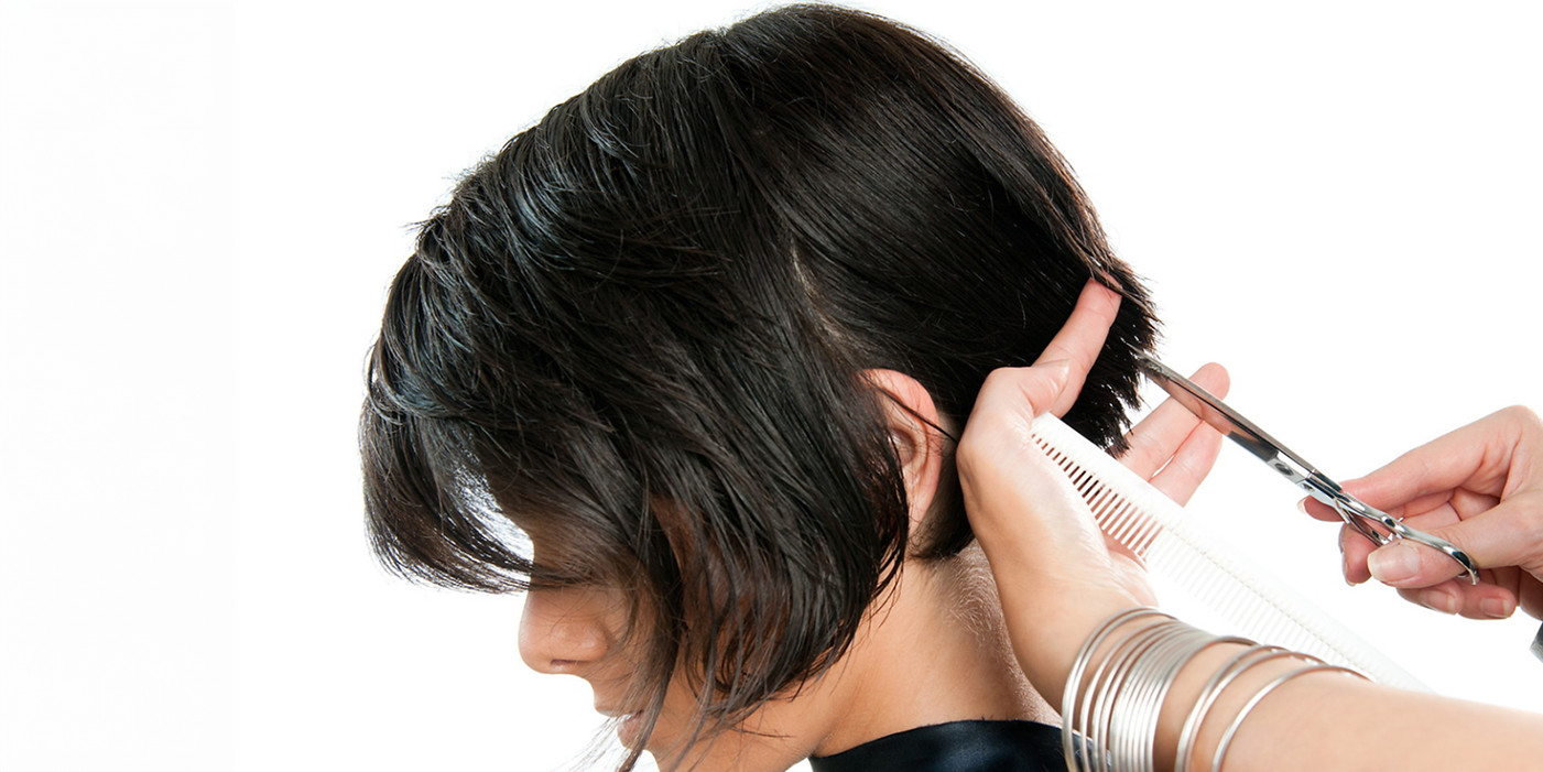 A barber cutting a person's hair