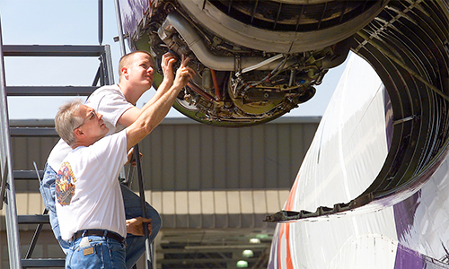 People working on jet