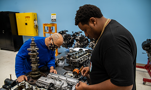 Image of person working on vehicle