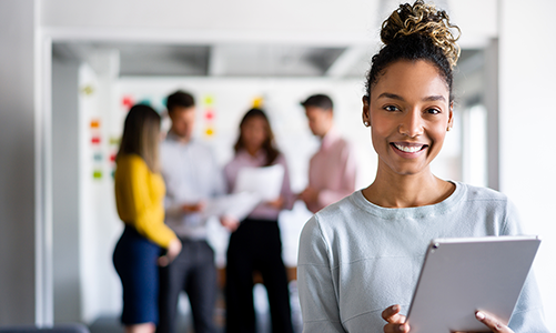 A smiling woman in an office setting