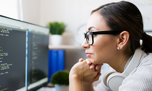 A woman looking at a computer